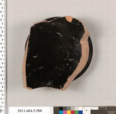 Terracotta fragment of a stemless kylix (drinking cup)