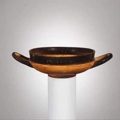 Terracotta stemless kylix (drinking cup)