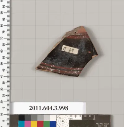 Terracotta fragment of a lekanis lid (covered dish)