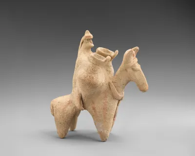 Terracotta statuette of a man riding a donkey