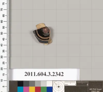 Terracotta fragment of a kylix: eye-cup (drinking cup)