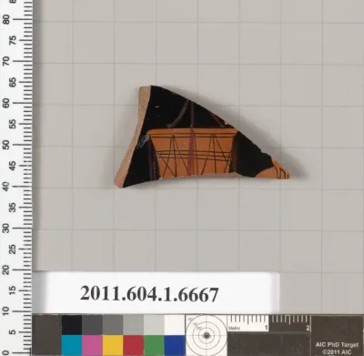 Terracotta fragment of a kylix (drinking cup)