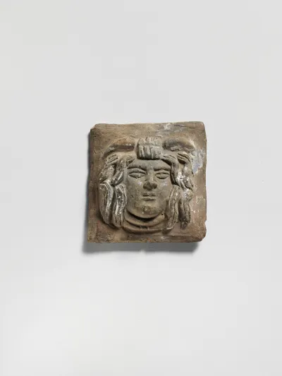 Terracotta relief plaque with head of Medusa