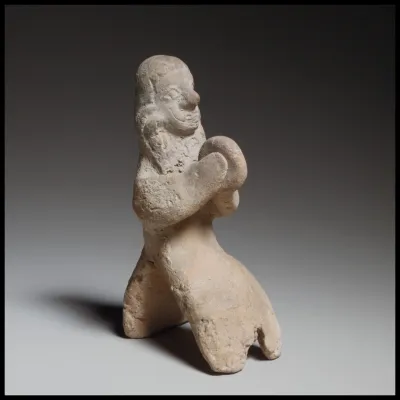 Seated female tambourine player