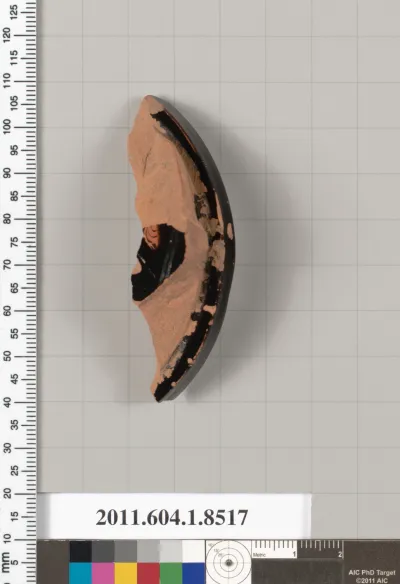 Terracotta fragment of a stemless kylix (drinking cup)