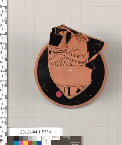 Terracotta fragment of a kylix (drinking cup)