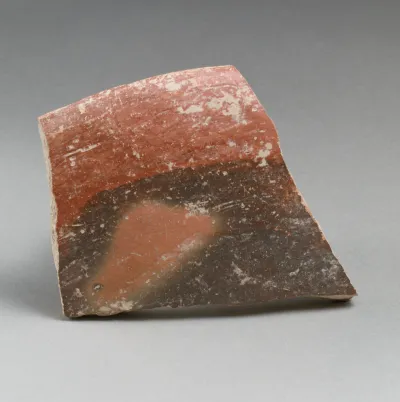 Terracotta rim fragment from a shallow bowl