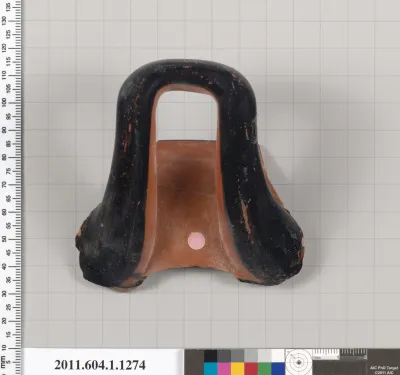 Terracotta fragment of a kylix (drinking cup)