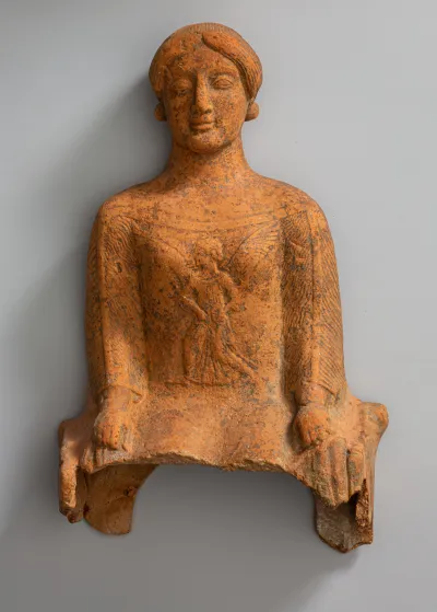 Terracotta figure of a seated woman