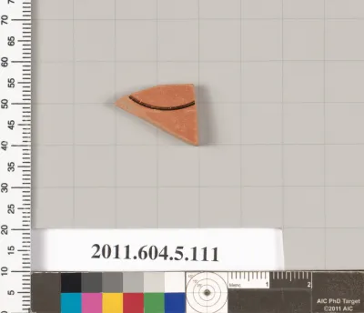 Terracotta fragment of a stemless kylix (drinking cup)