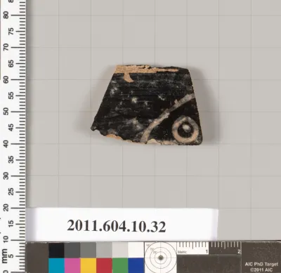 Terracotta fragment of a kylix (drinking cup)