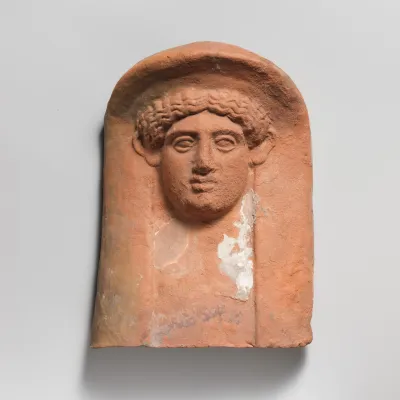 Terracotta relief head of a woman