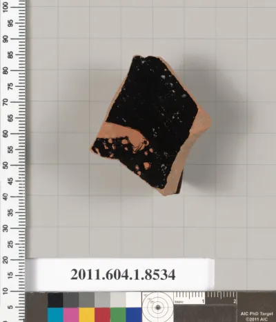 Terracotta fragment of a stemless kylix (drinking cup)