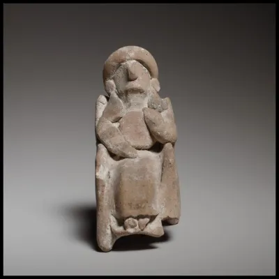 Seated female figurine