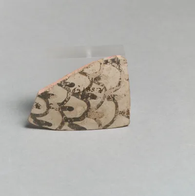 Terracotta vessel fragment with scale pattern