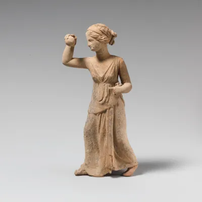 Terracotta statuette of a girl playing ball