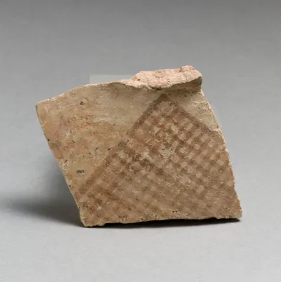 Terracotta upper-body fragment with hatched triangle, probably from a pyxis (box with lid)