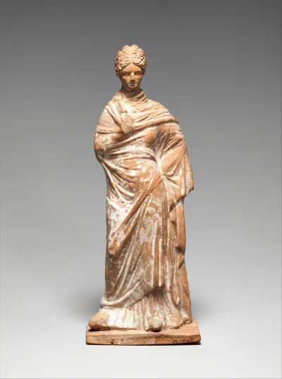 Terracotta statuette of a standing woman
