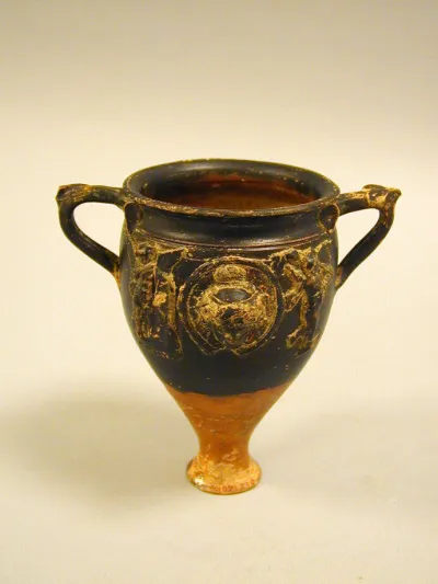 Terracotta cup with appliqués