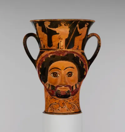 Terracotta kantharos (drinking cup) in the form of the heads of Herakles and of a woman