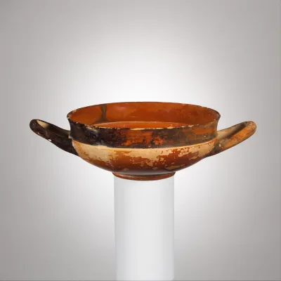 Terracotta stemless kylix (drinking cup)