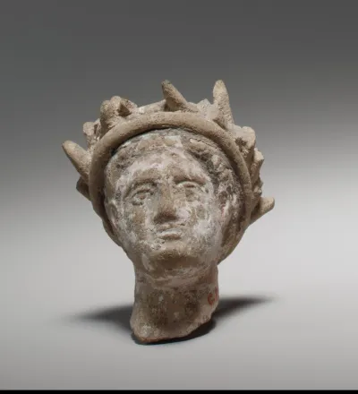 Terracotta male head wearing a wreath