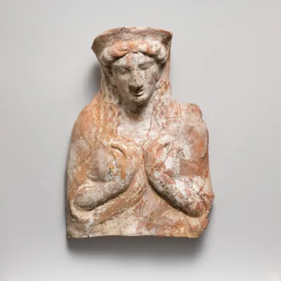 Terracotta relief with bust of a woman