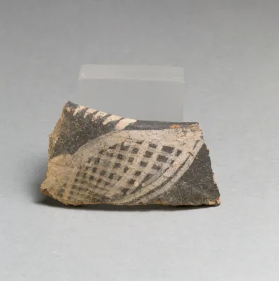 Terracotta rim fragment with hatched form