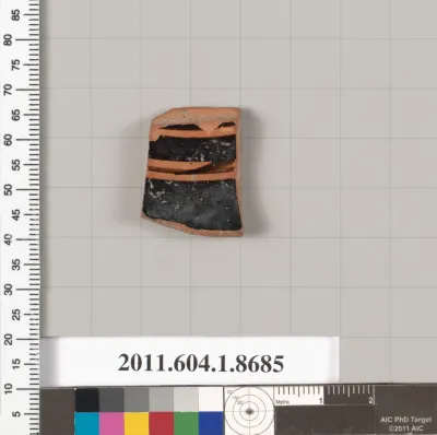 Terracotta fragment of a stemless kylix (drinking cup)