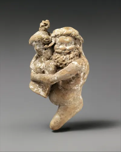 Terracotta statuette of a satyr and maenad
