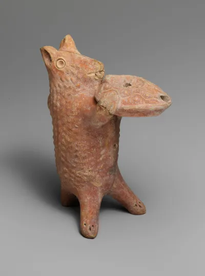 Terracotta statuette of a bear holding an oil lamp