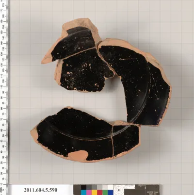 Terracotta fragment of a stemless kylix (drinking cup)