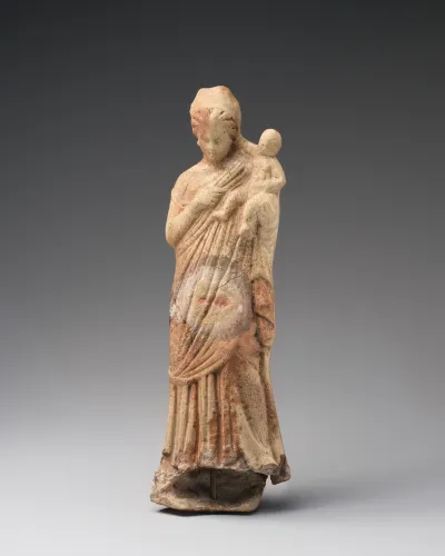 Terracotta statuette of a woman holding a baby