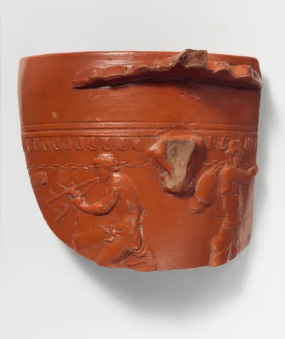 Terracotta fragment of an Arretine cup with satyrs