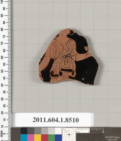 Terracotta fragment of a stemless kylix (drinking cup)