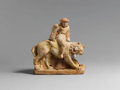 Terracotta statuette of Eros on a lion
