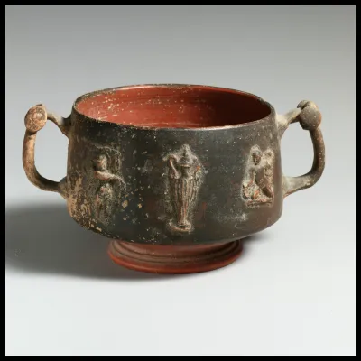 Terracotta cup with appliqués