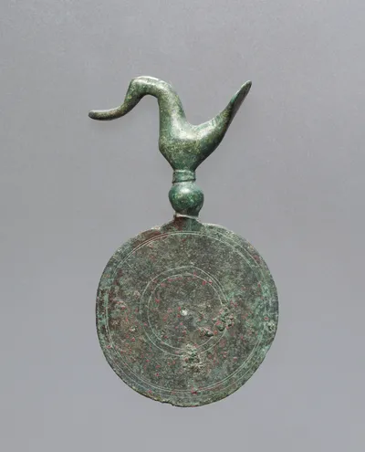 Pendant in the Form of a Bird Atop a Disk