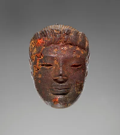 Pendant: Head of a Female Divinity or Sphinx