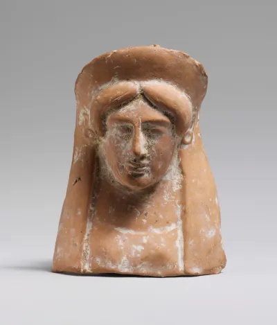 Terracotta relief with the head and neck of a woman