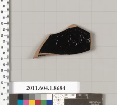 Terracotta fragment of a stemless kylix (drinking cup)