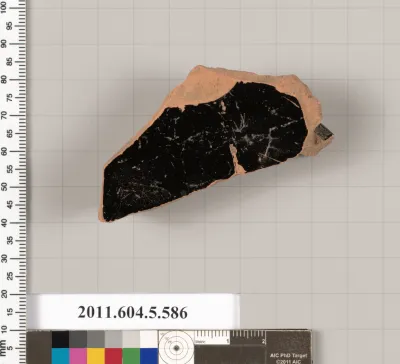 Terracotta fragment of a stemless kylix (drinking cup)