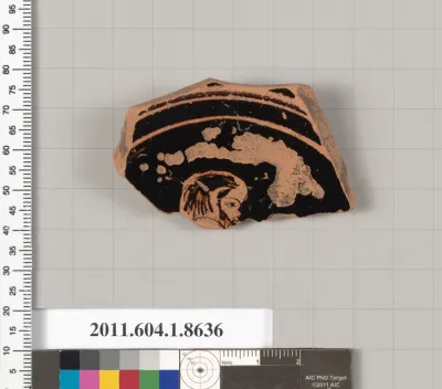 Terracotta fragment of a stemless kylix (drinking cup)