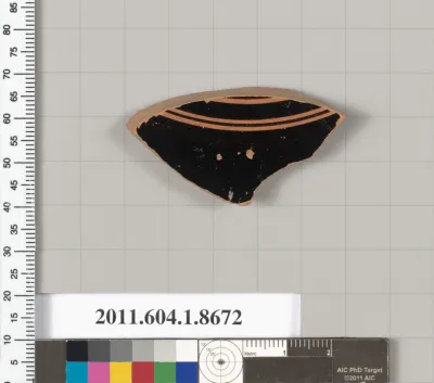 Terracotta fragment of a stemless kylix (drinking cup)
