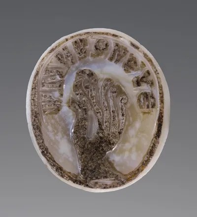 Cameo Gem with a Hand pinching an Ear
