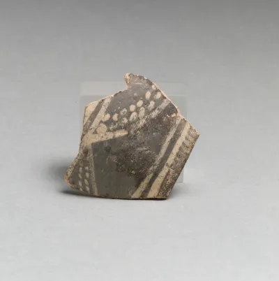 Terracotta rim fragment with bands and dots