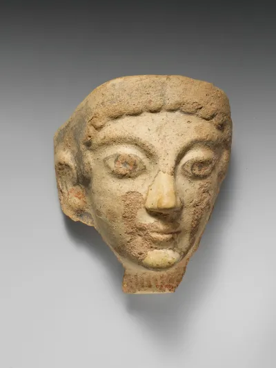 Terracotta antefix (roof tile) with female head