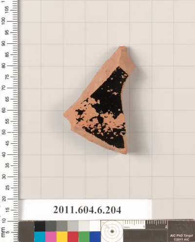 Terracotta fragment of a lid?