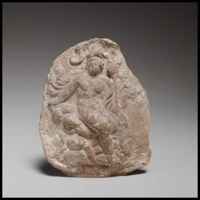 Relief depicting a seated figure, probably Dionysos