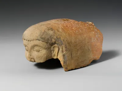 Terracotta antefix (roof tile) with female head